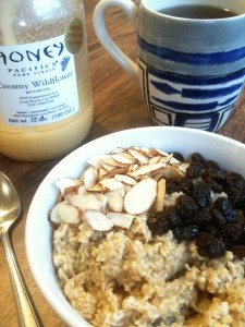 Wildflower Honey Oatmeal with almonds, raisins and coffee to drink.